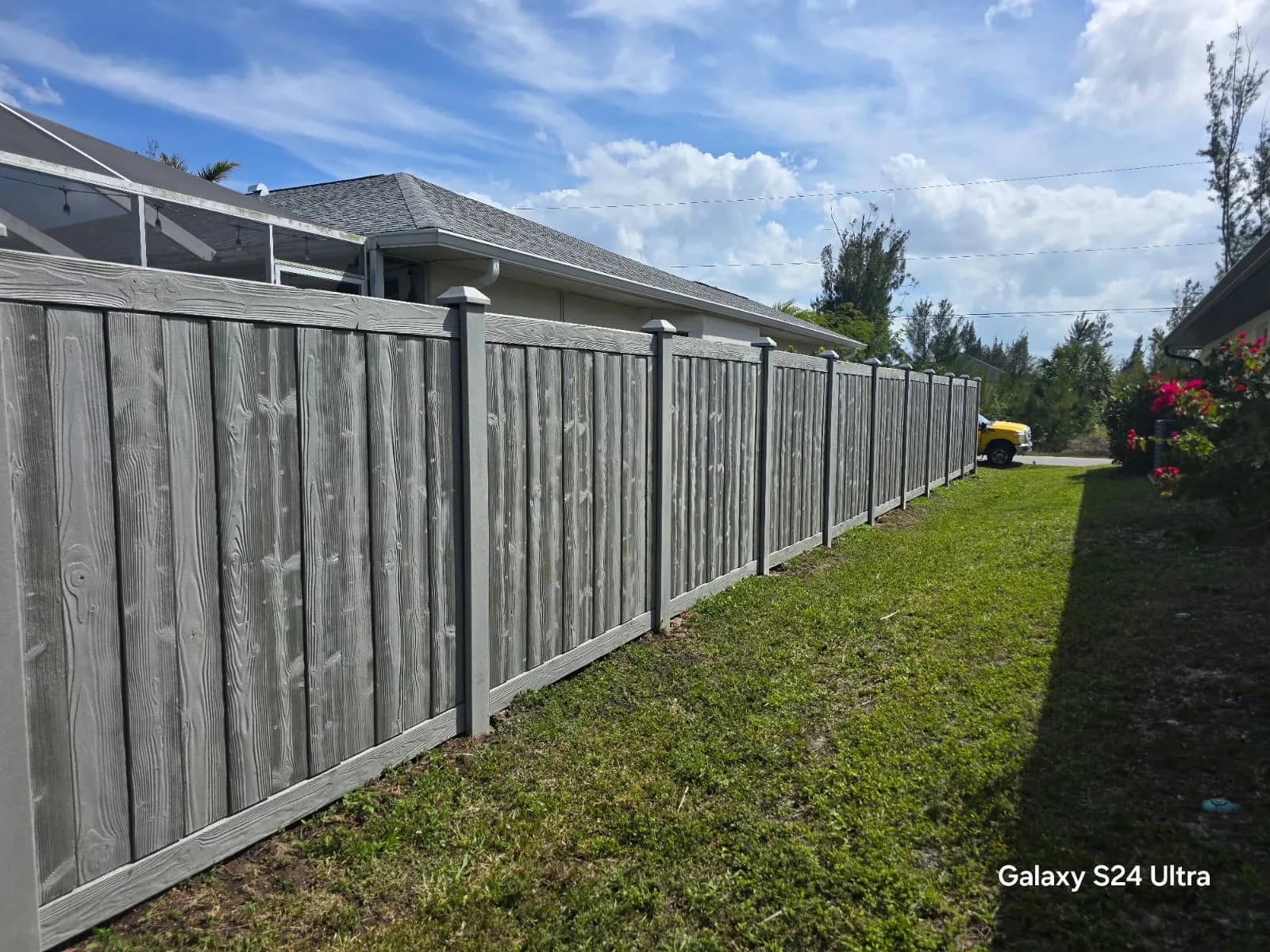 Composite fence installed along a Southwest Florida property line