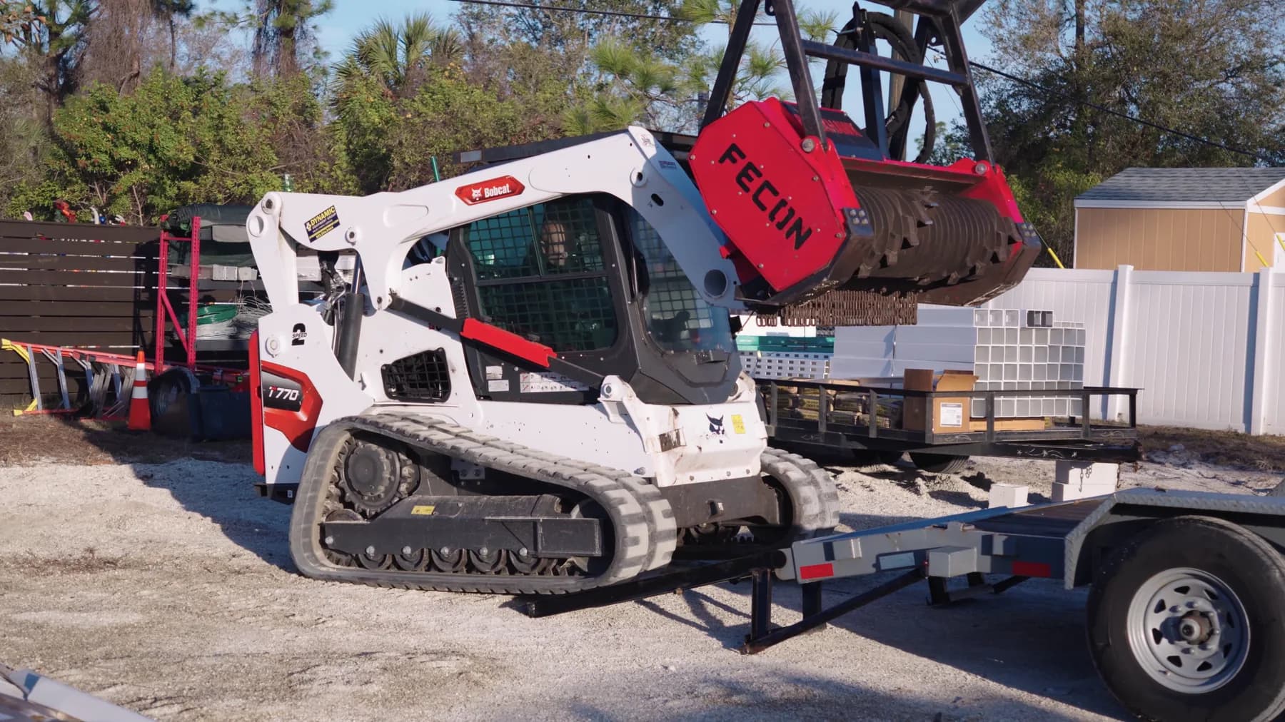 Land clearing equipment loaded for a True Fence Florida project